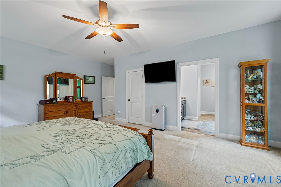 4875 Kimber Lane Gum Spring, VA 23065 - Photo 30 of 48 a bedroom with a bed and a flat screen tv