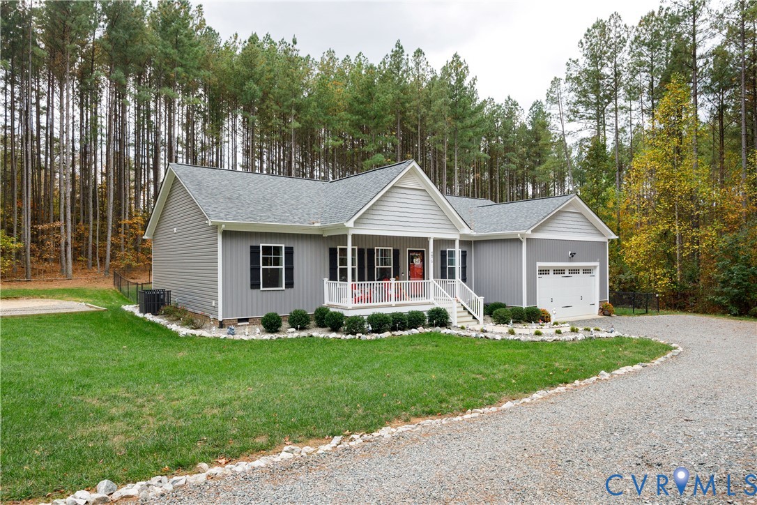 4875 Kimber Lane Gum Spring, VA 23065 - Photo 3 of 48 a front view of a house with a yard and trees
