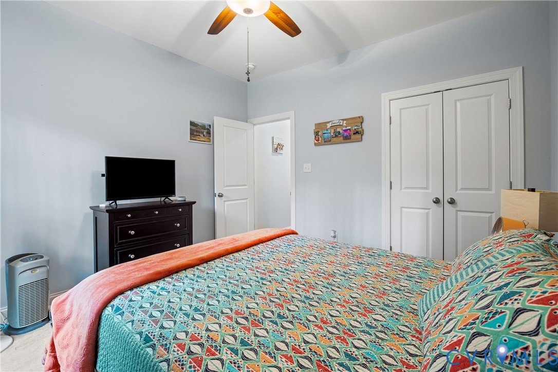 4875 Kimber Lane Gum Spring, VA 23065 - Photo 31 of 48 a bedroom with a bed and a flat screen tv