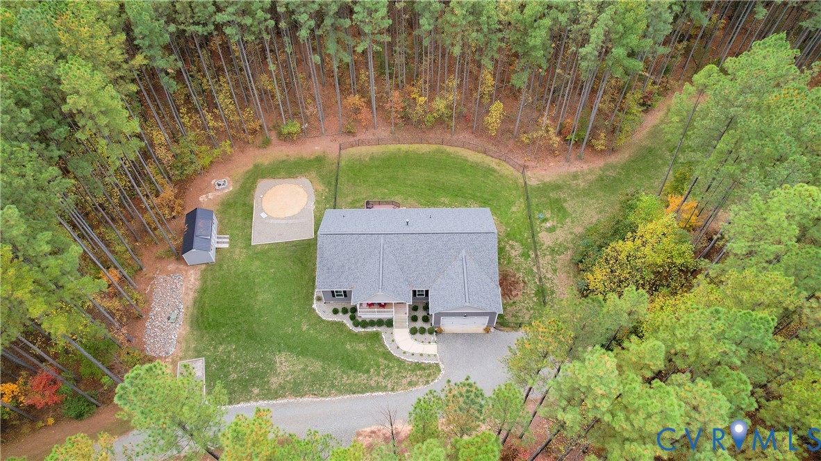 4875 Kimber Lane Gum Spring, VA 23065 - Photo 41 of 48 an aerial view of a house with garden space and trees all around
