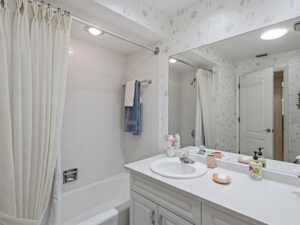 314 Torrey Pines Point Naples, FL 34113 - Photo 13 of 21 a bathroom with a sink double vanity granite tub shower and a mirror