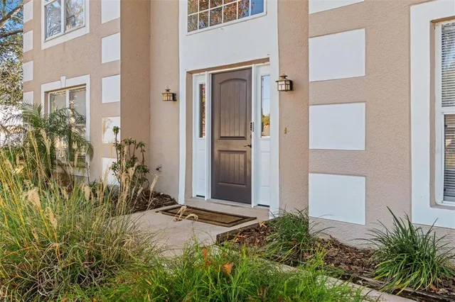 a bathroom with a sink mirror and toilet