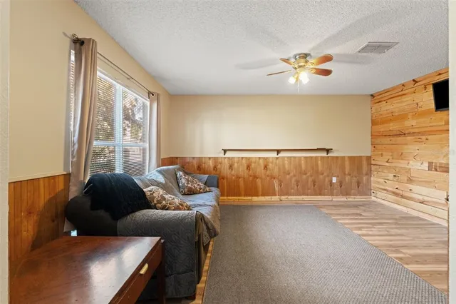 a kitchen with stainless steel appliances granite countertop a stove refrigerator sink and microwave