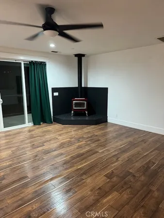 a living room with hard wood floors