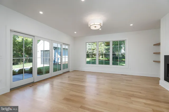 a kitchen with a sink a stove and cabinets