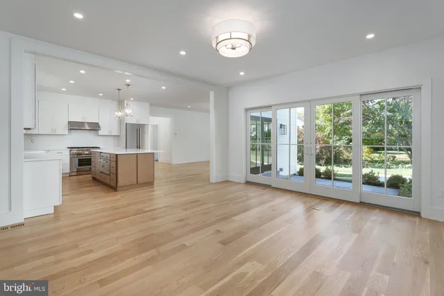 a kitchen with stainless steel appliances a sink and cabinets