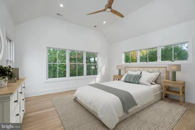 a bathroom with a granite countertop sink a toilet and a mirror