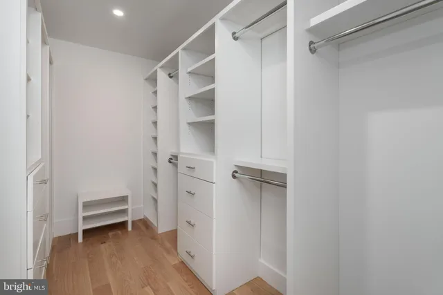a bathroom with a white bath tub and a shower