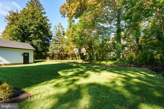 a front view of house with a garden