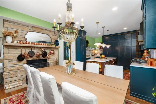 a kitchen with a table and chairs