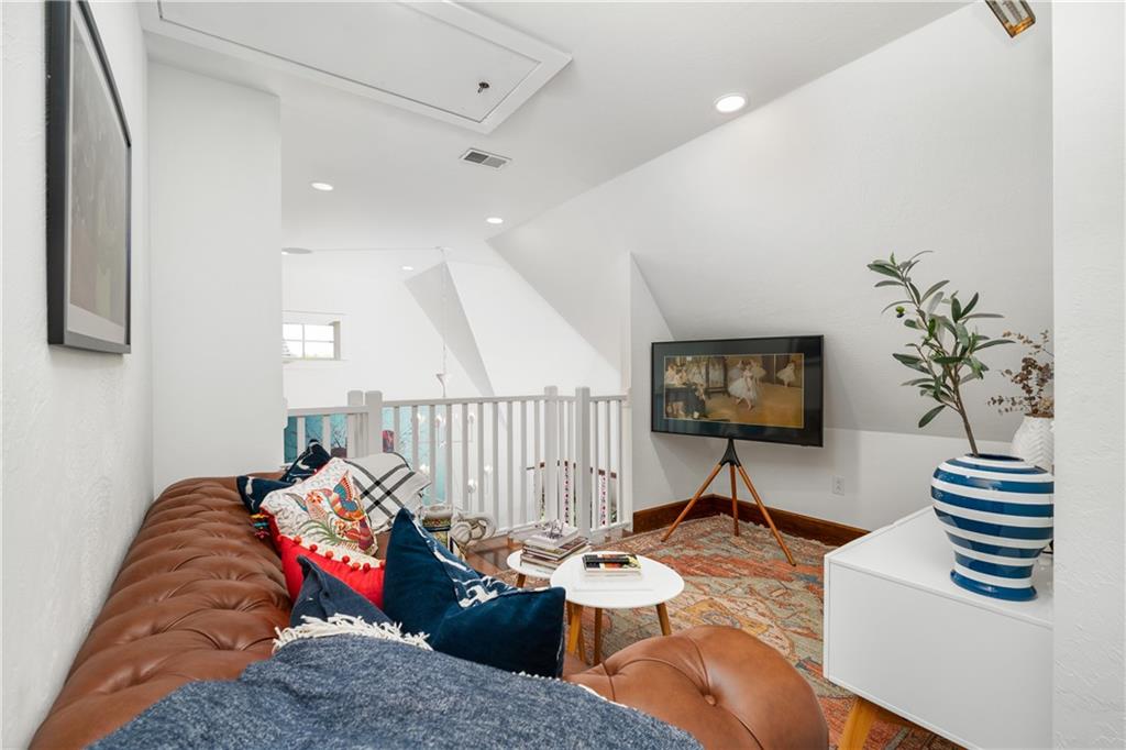 311 Derry Ridge Road Ligonier, PA 15658 - Photo 19 of 42 a living room with furniture and a flat screen tv