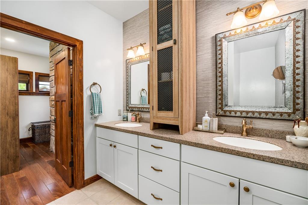 311 Derry Ridge Road Ligonier, PA 15658 - Photo 21 of 42 a en suite bathroom with double vanity sinks and a mirror