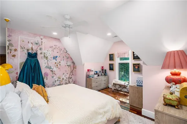 a bed room with a bed and a large mirror