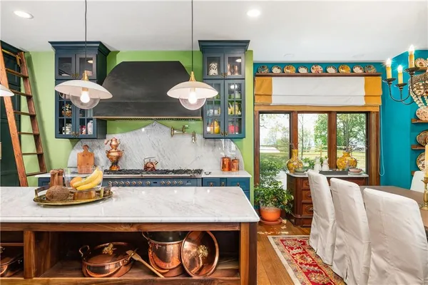 a kitchen with a table and chairs in it