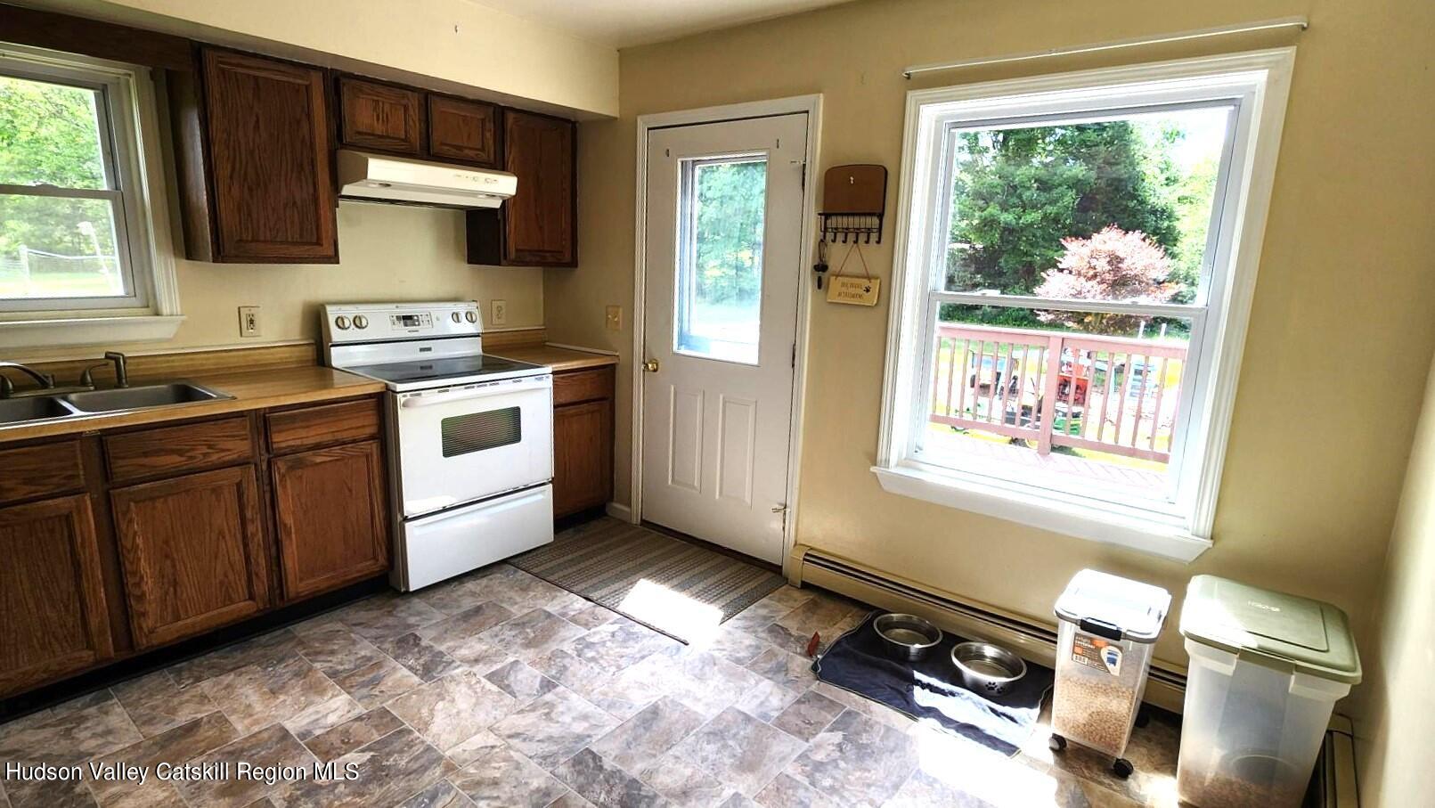 1262 County Road 2 Olivebridge, NY 12461 - Photo 17 of 42 a kitchen with a sink appliances cabinets and a window