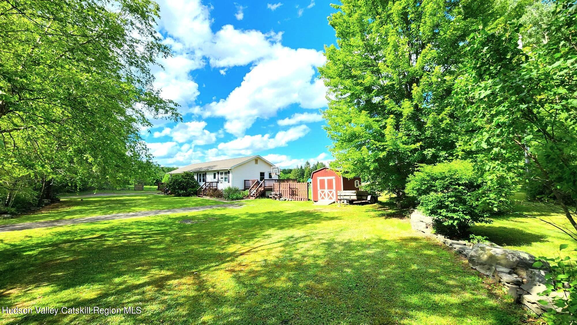 1262 County Road 2 Olivebridge, NY 12461 - Photo 38 of 42 a view of a big yard with plants and large trees