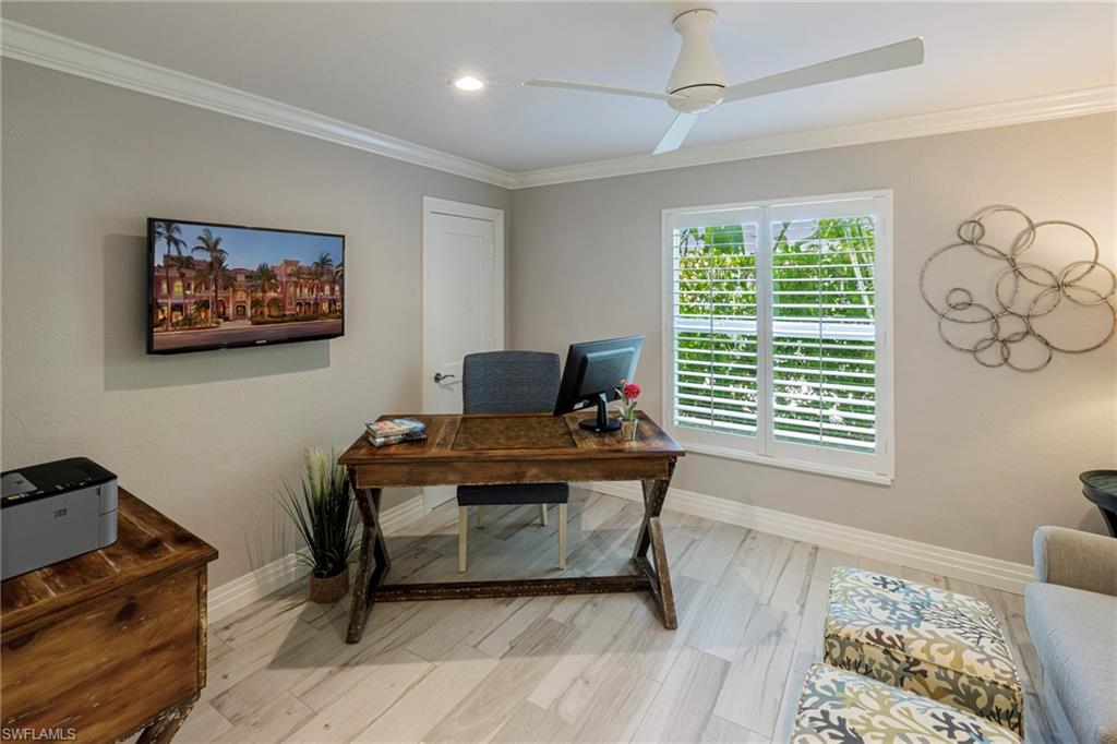 3720 Parkview Way Naples, FL 34103 - Photo 11 of 29 Office area with ceiling fan, light hardwood / wood-style flooring, and ornamental molding