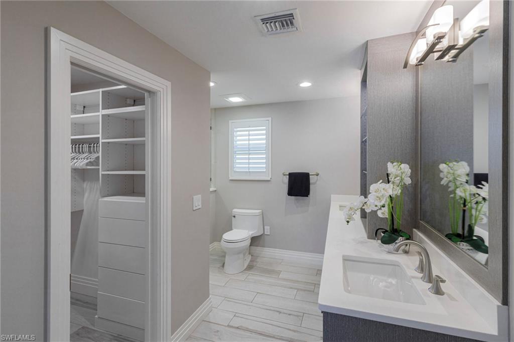 3720 Parkview Way Naples, FL 34103 - Photo 14 of 29 Bathroom featuring dual bowl vanity and toilet