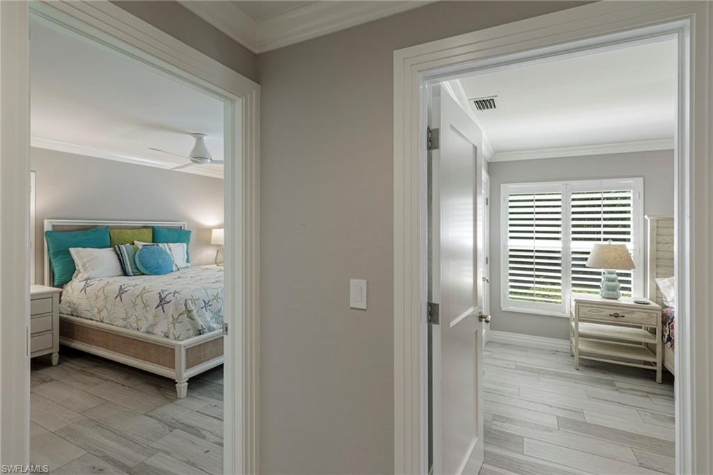 3720 Parkview Way Naples, FL 34103 - Photo 19 of 29 Bedroom featuring ceiling fan, ornamental molding, and light wood-type flooring