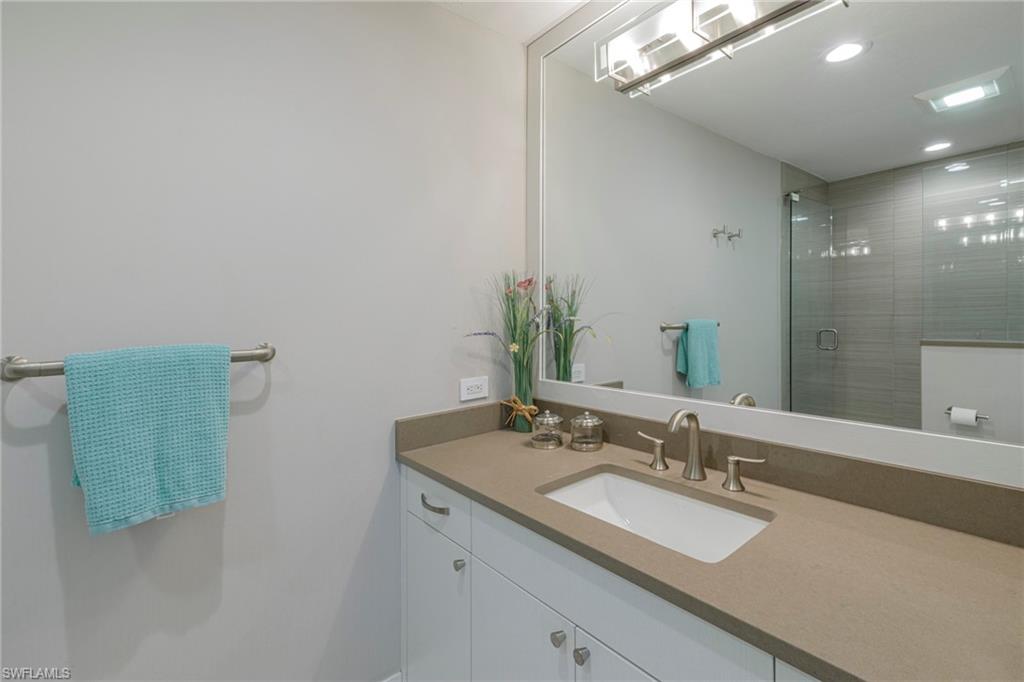 3720 Parkview Way Naples, FL 34103 - Photo 22 of 29 Bathroom with walk in shower and vanity