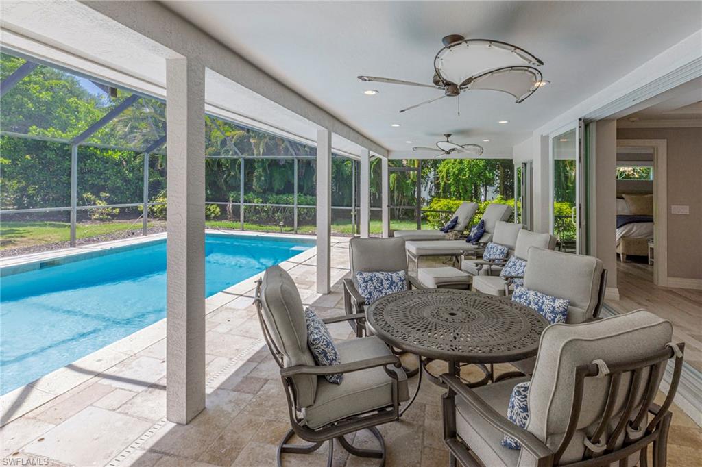 3720 Parkview Way Naples, FL 34103 - Photo 7 of 29 View of pool featuring a patio, an outdoor hangout area, a lanai, and ceiling fan