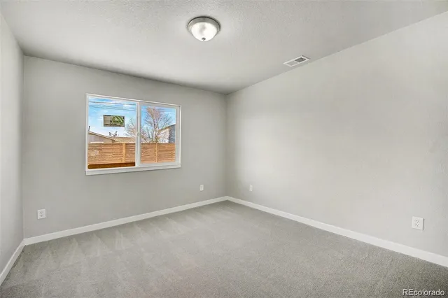 a bathroom with a sink and mirror with toilet