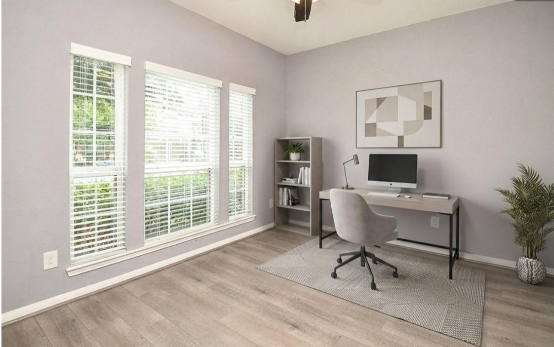 7042 Sliding Rock Circle Spring, TX 77379 - Photo 4 of 36 Virtually Staged, Stylish and inviting home office, beautifully staged to inspire productivity and creativity.