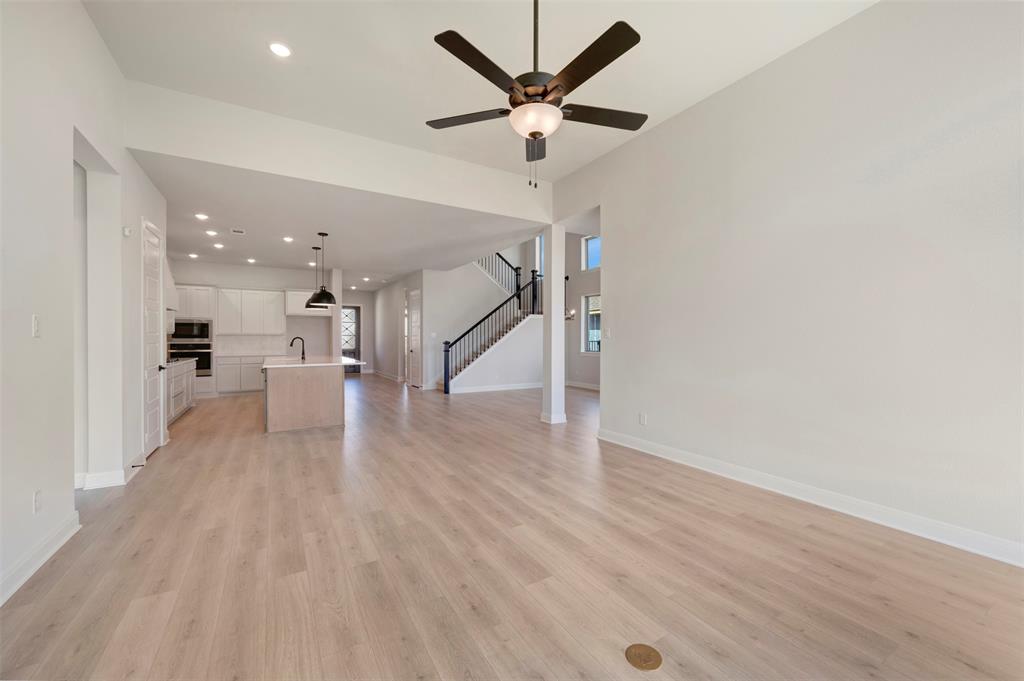 3575 Redbud Flower Trail Venus, TX 76084 - Photo 28 of 36 Unfurnished living room with recessed lighting, light wood finished floors, and a ceiling fan