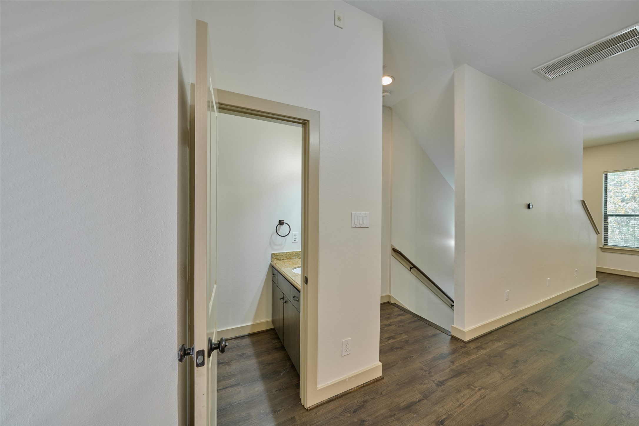 2422 Navigation Boulevard, Unit E Houston, TX 77003 - Photo 19 of 29 a view of a hallway with closet and wooden floor