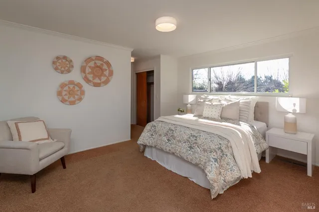 a bathroom with double vanity sink a mirror and shower