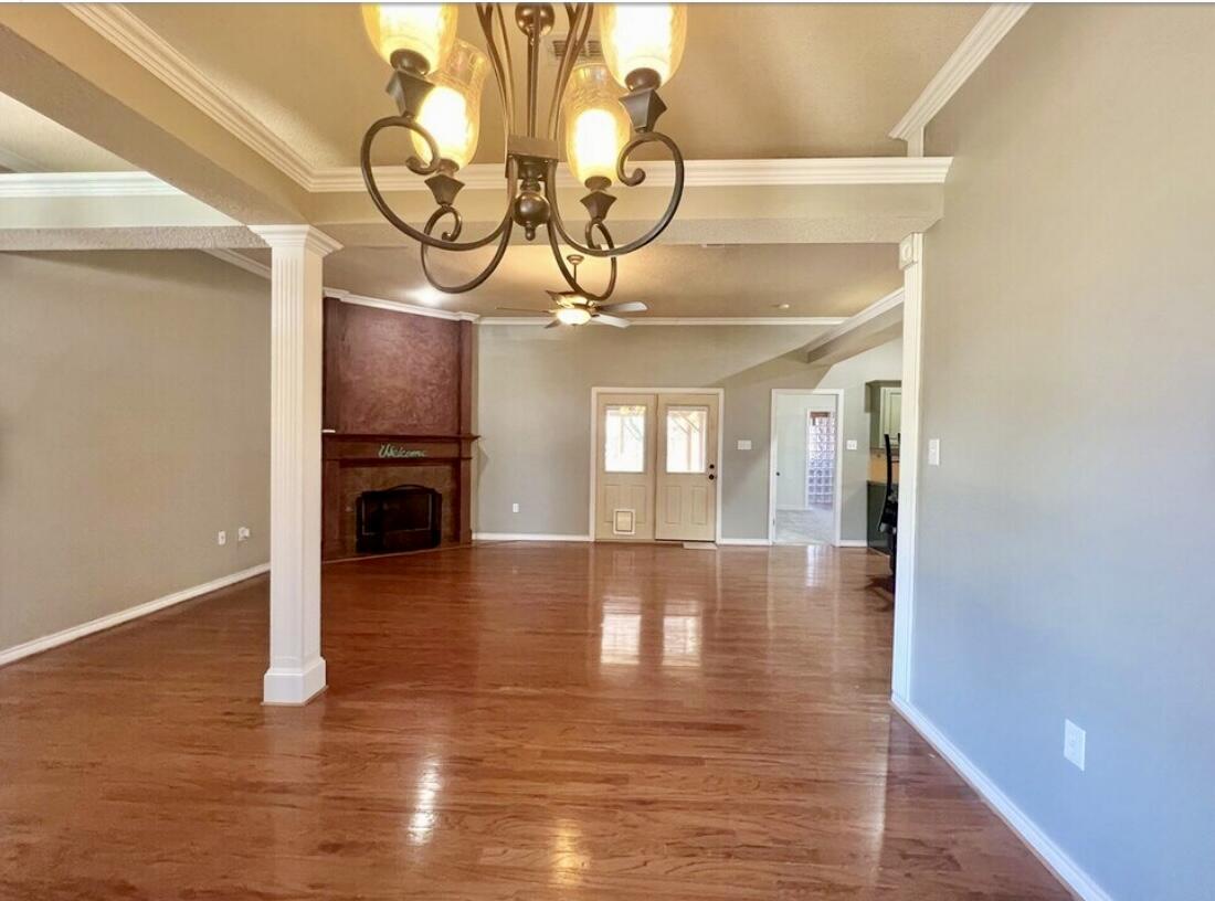 6805 36th Street Lubbock, TX 79407 - Photo 4 of 12 a view of empty room with wooden floor
