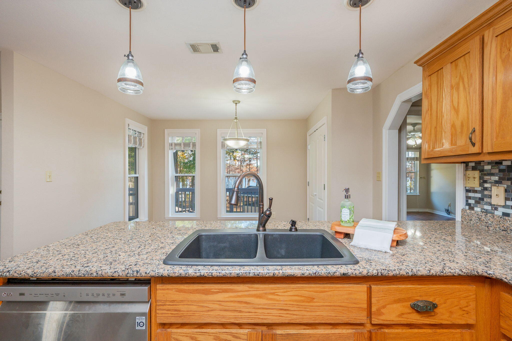 516 Blue Pond Circle Ponce de Leon, FL 32455 - Photo 17 of 39 a view of a kitchen with granite countertop a sink and a large window