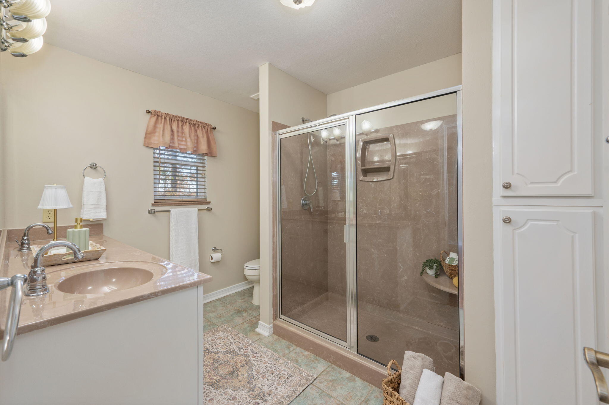 516 Blue Pond Circle Ponce de Leon, FL 32455 - Photo 21 of 39 a bathroom with a shower sink and mirror