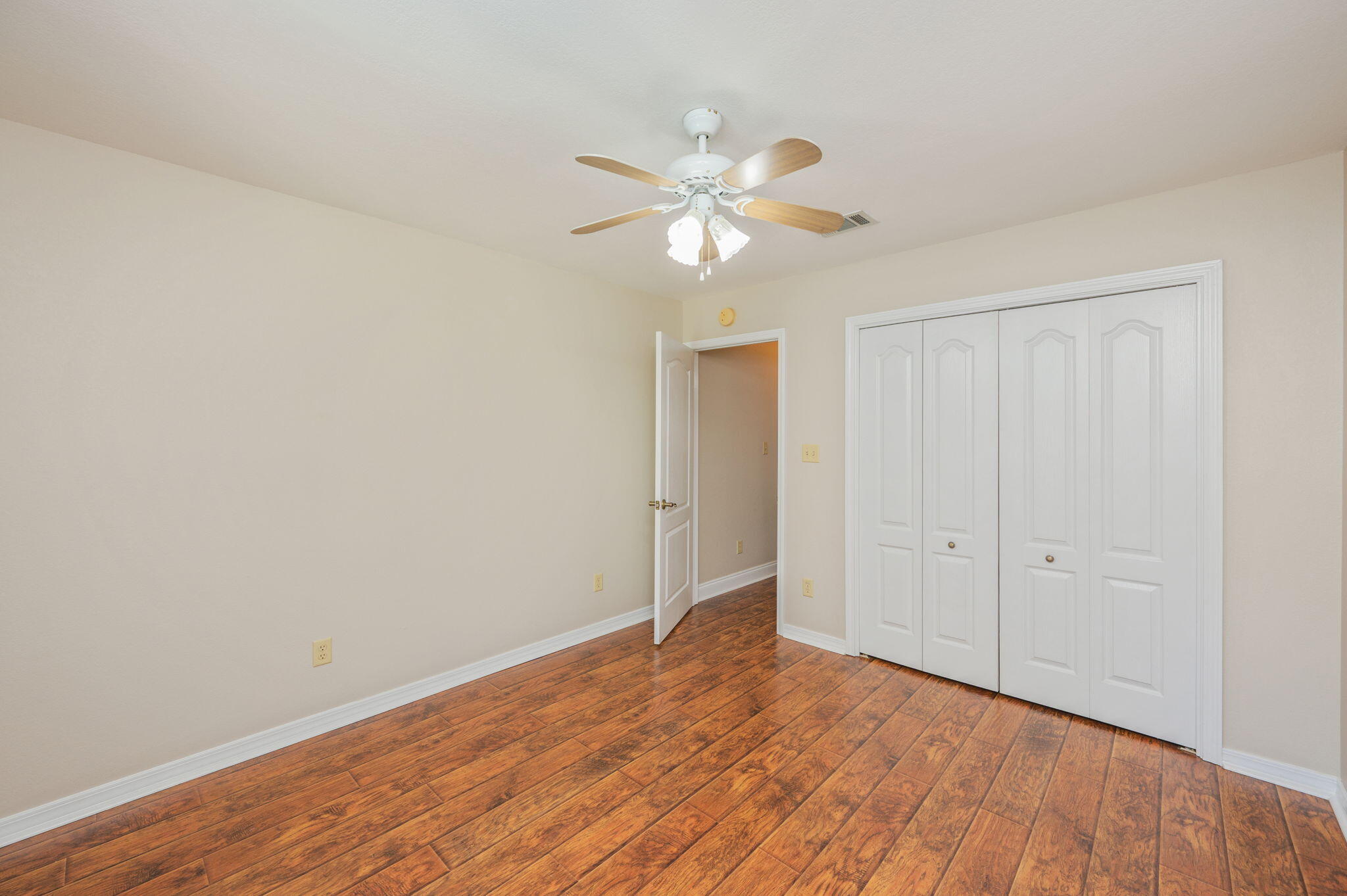 516 Blue Pond Circle Ponce de Leon, FL 32455 - Photo 27 of 39 a view of empty room with wooden floor