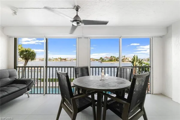 a view of a dining room with furniture window and outside view