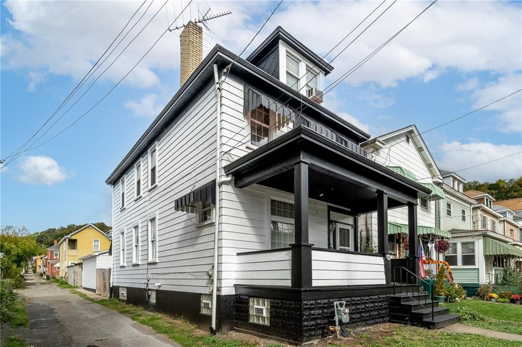 front view of a house with a street