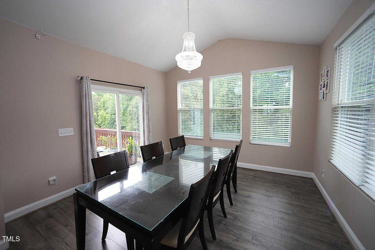 4416 Walker Hallow Street Raleigh, NC 27616 - Photo 12 of 28 a view of a dining room with furniture window and outside view