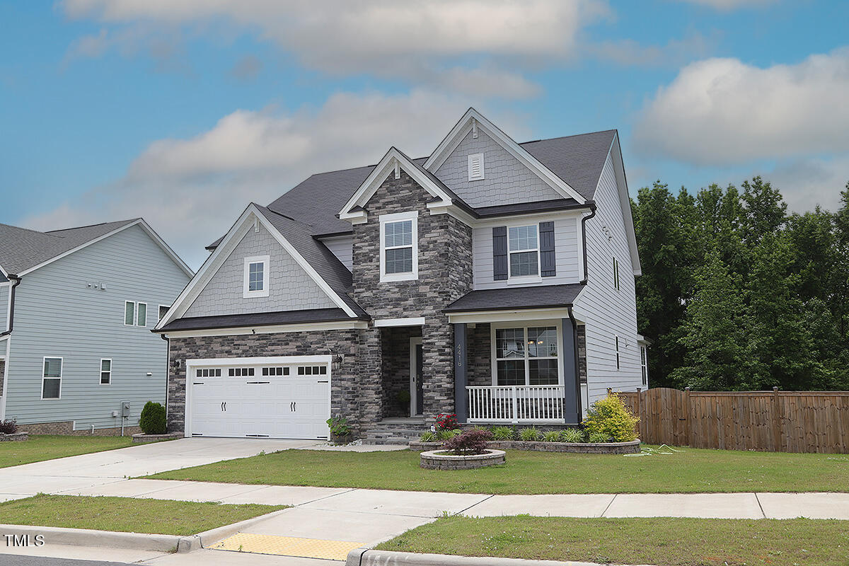 4416 Walker Hallow Street Raleigh, NC 27616 - Photo 2 of 28 a front view of a house with a yard