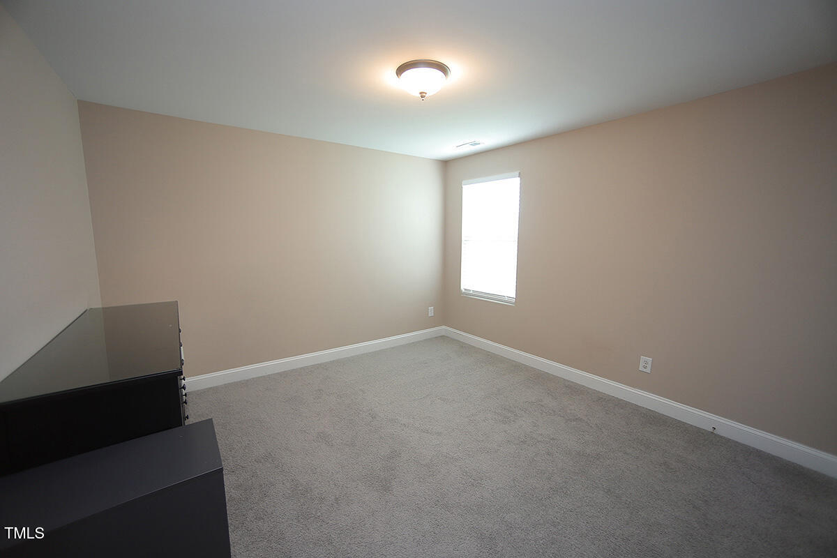 4416 Walker Hallow Street Raleigh, NC 27616 - Photo 25 of 28 an empty room with windows