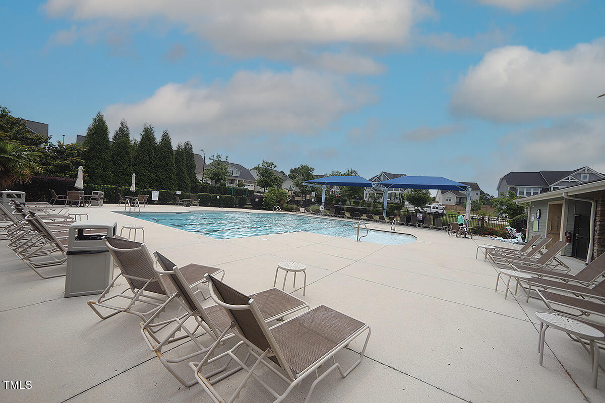 4416 Walker Hallow Street Raleigh, NC 27616 - Photo 27 of 28 a view of swimming pool with outdoor seating and plants