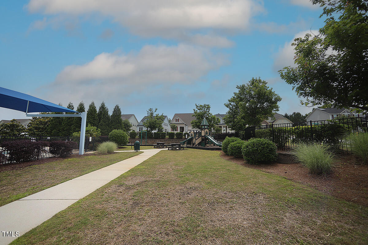 4416 Walker Hallow Street Raleigh, NC 27616 - Photo 28 of 28 a view of a lake with a yard