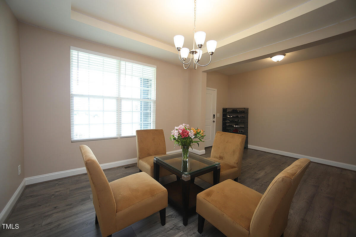 4416 Walker Hallow Street Raleigh, NC 27616 - Photo 3 of 28 a dining room with furniture and window