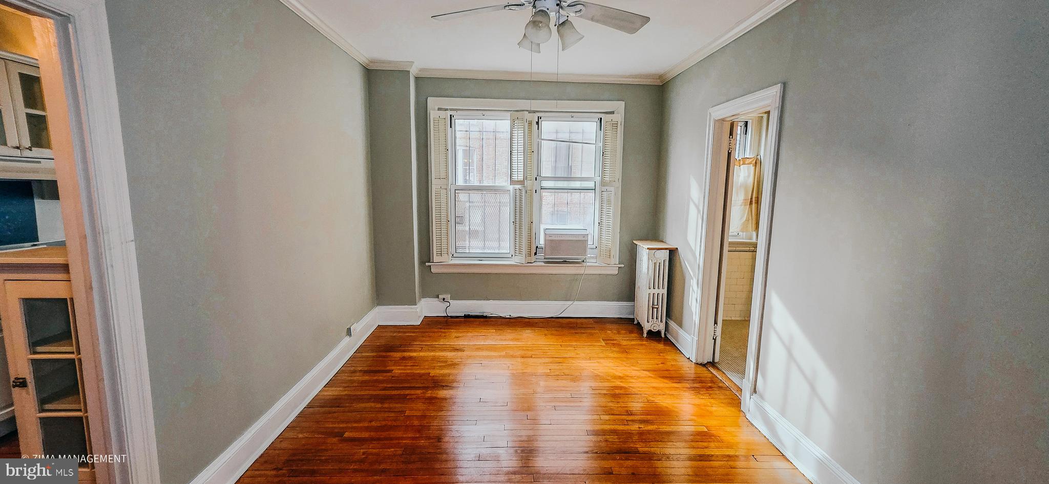 1954 Columbia Road Northwest, Unit 104 Washington, DC 20009 - Photo 5 of 17 a view of a room with wooden floor and cabinet