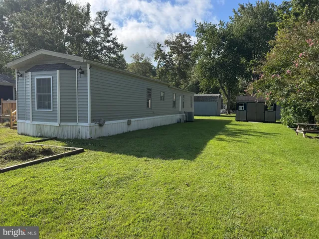 a view of a backyard with a small cabin