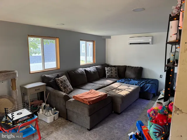 a living room with furniture and a window