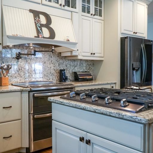 1895 Zeb Warren Road Cookeville, TN 38506 - Photo 30 of 70 a kitchen with stainless steel appliances granite countertop a stove and a granite counter tops