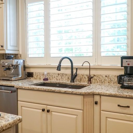 1895 Zeb Warren Road Cookeville, TN 38506 - Photo 32 of 70 a kitchen with granite countertop a sink and a window