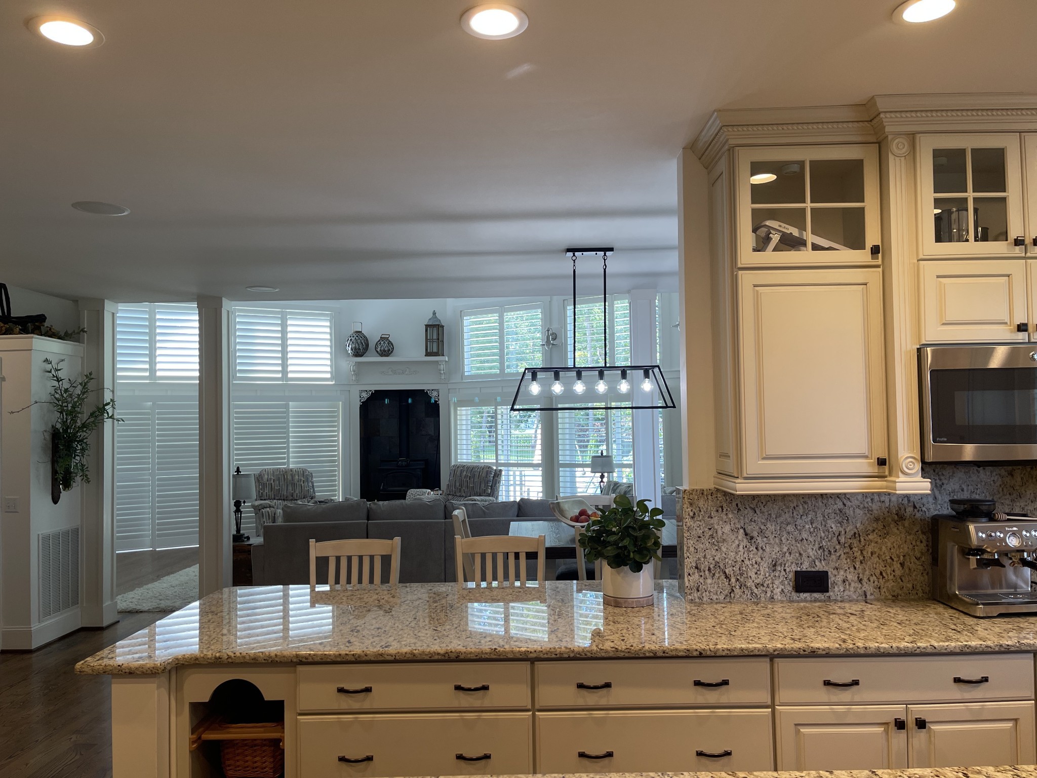 1895 Zeb Warren Road Cookeville, TN 38506 - Photo 36 of 70 a kitchen with granite countertop a stove a sink and a wooden cabinets