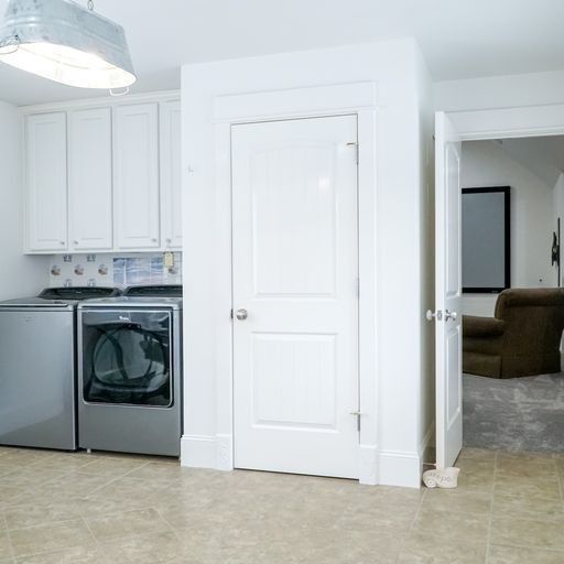 1895 Zeb Warren Road Cookeville, TN 38506 - Photo 52 of 70 a utility room with closet dryer and washer