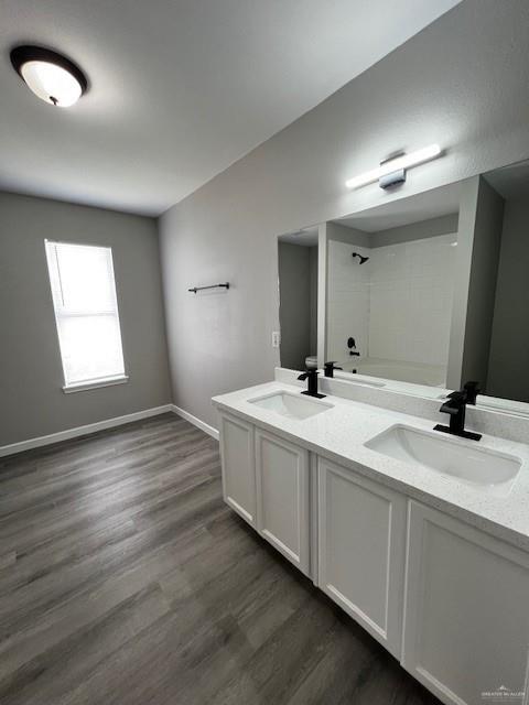 2912 Ozark Avenue McAllen, TX 78504 - Photo 17 of 21 a bathroom with double vanity sink a mirror and a window